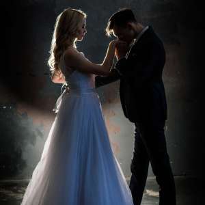 Art fashion studio photo of wedding couple silhouette groom and bride on colors background. Art Wedding style.