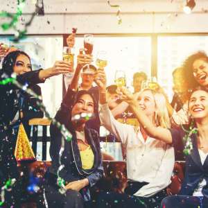 Merry Christmas and Happy New Year, Business people celebrating with cheerful and hand holding glasses of champagne in the office.